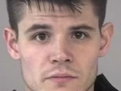 The picture is a mugshot of Josh Drummond.